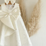 Christening dress with big bow.